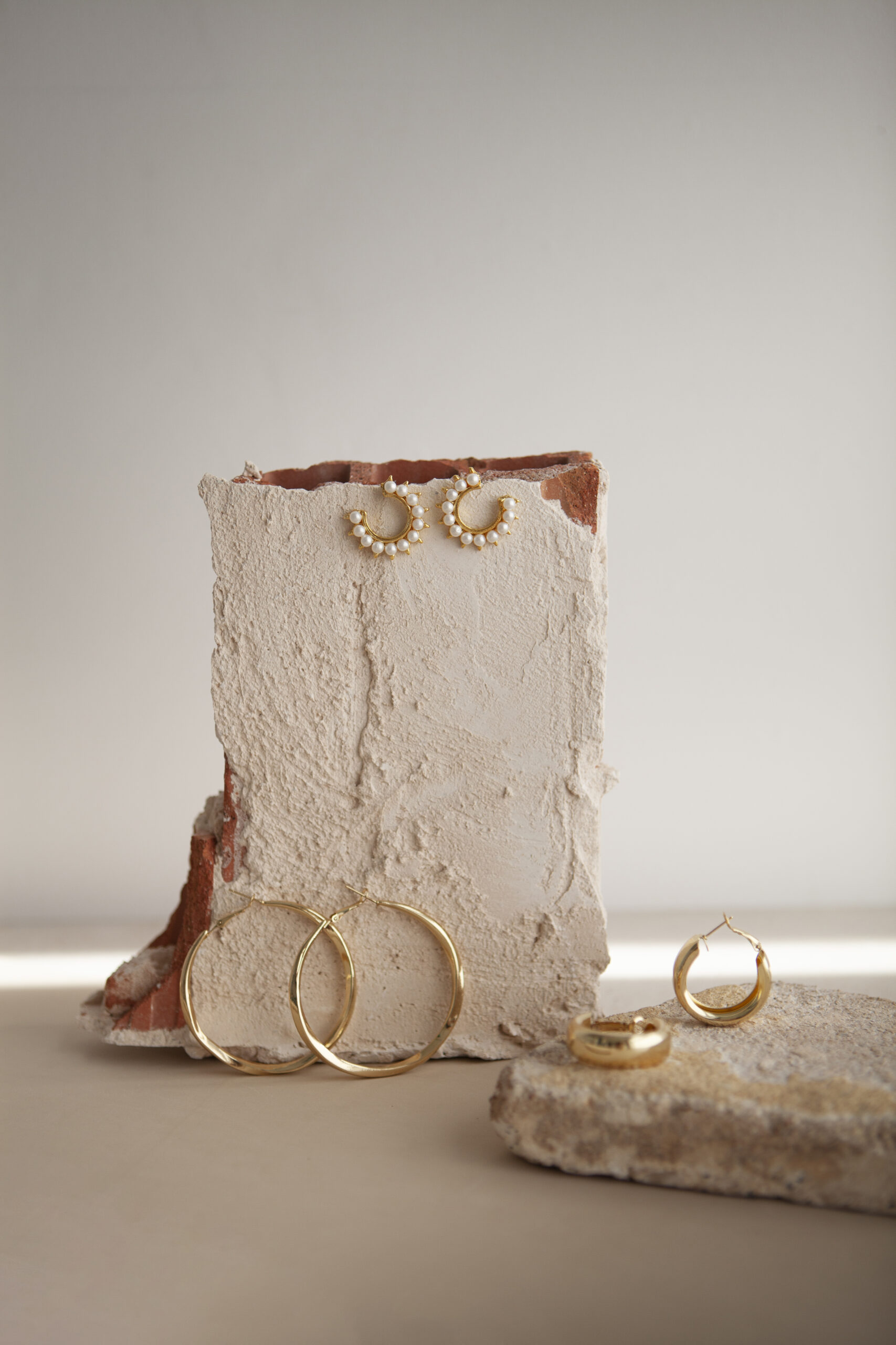 aesthetic golden earrings arrangement